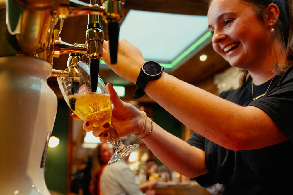 A pint being poured at the Smokey Shed bar