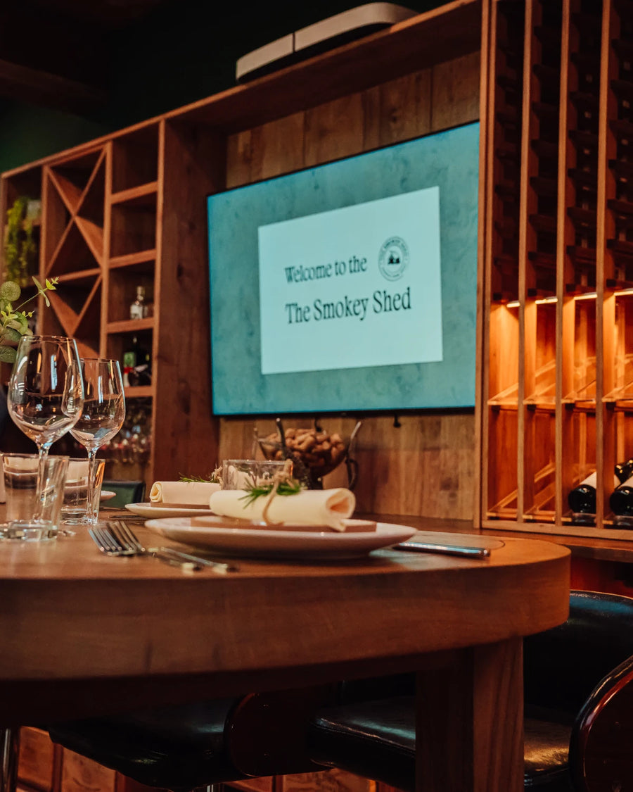 The big screen above the table